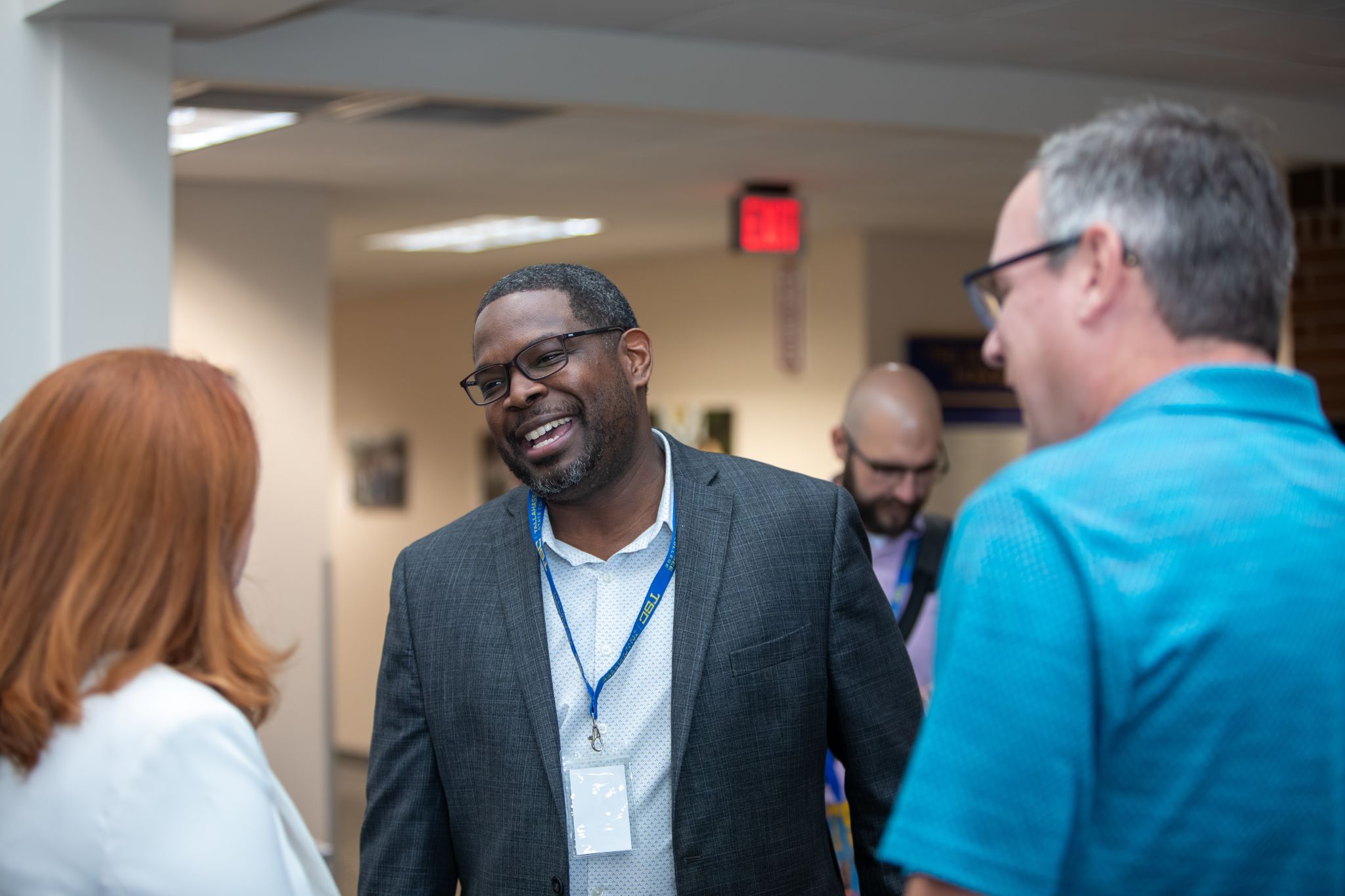 Summit attendees networking during the reception.