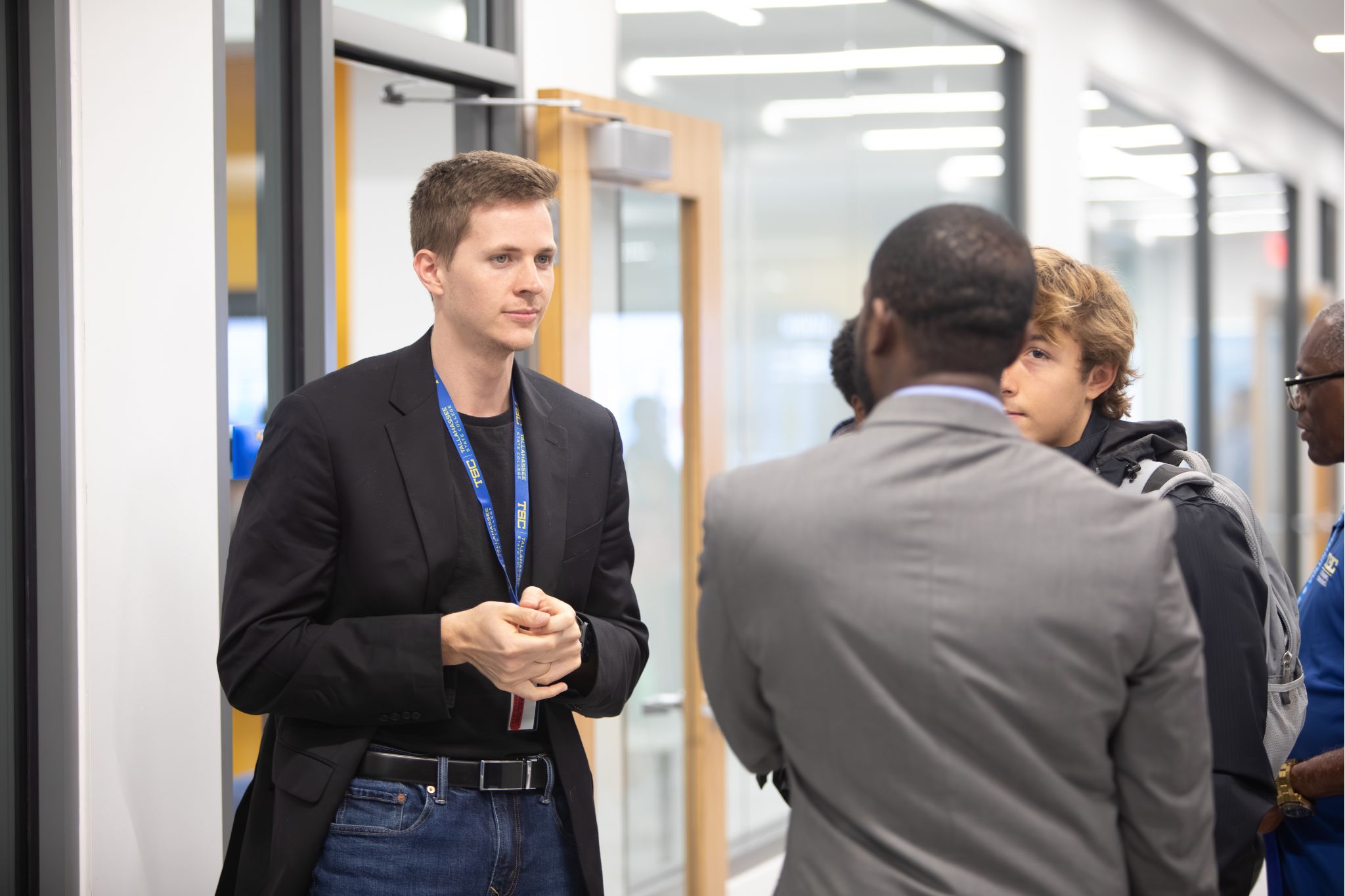 Summit attendees networking in the Innovation Hub.