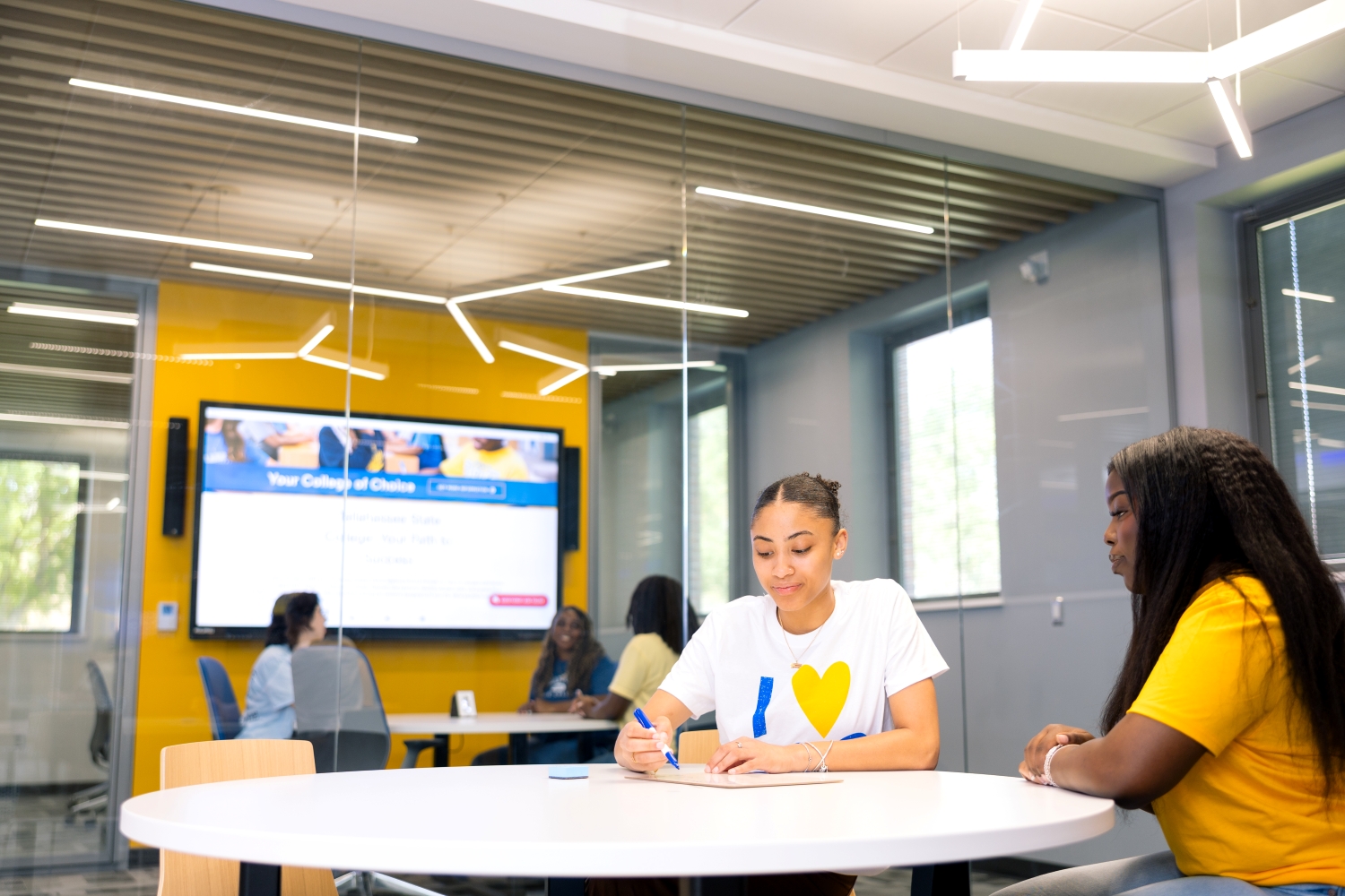 Students studying in the Innovation Hub lounge.