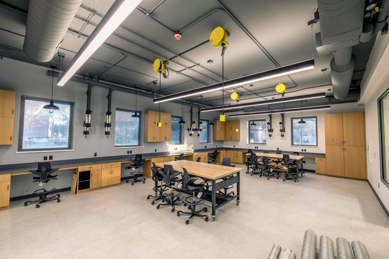 Lab with worktables and equipment along the walls.