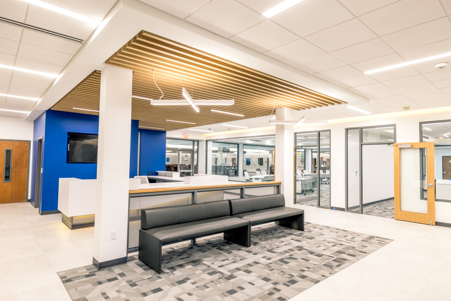 Empty Innovation Hub lobby with sofas and front desk.