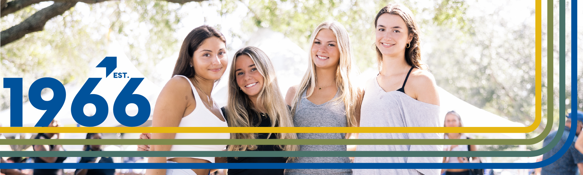 Four female TSC students posed together and smiling.